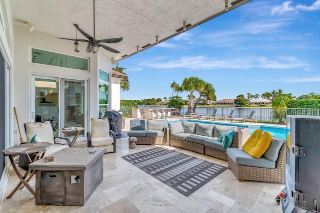 view of patio featuring an outdoor living space, a water view, a fenced in pool, and ceiling fan