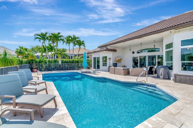 view of pool featuring area for grilling, an outdoor hangout area, a patio, and ceiling fan