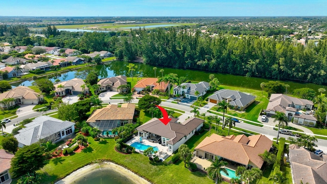 birds eye view of property with a water view