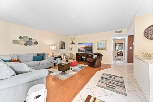 living room with light tile patterned floors