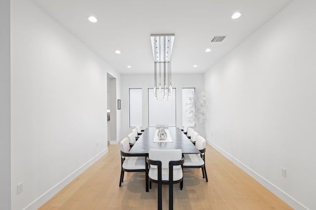 dining space with light hardwood / wood-style flooring