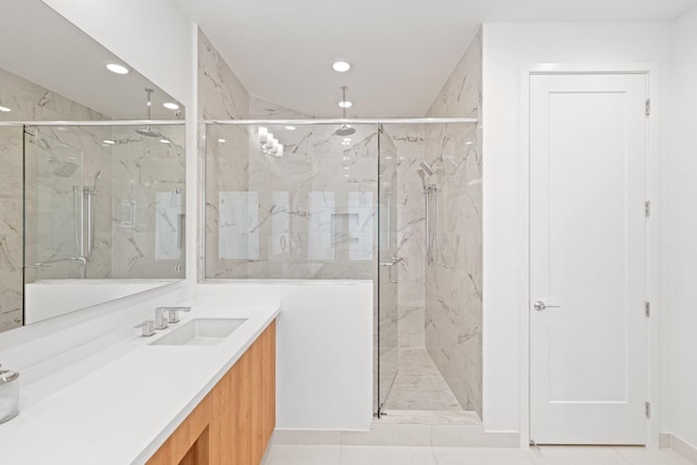 bathroom with vanity and an enclosed shower