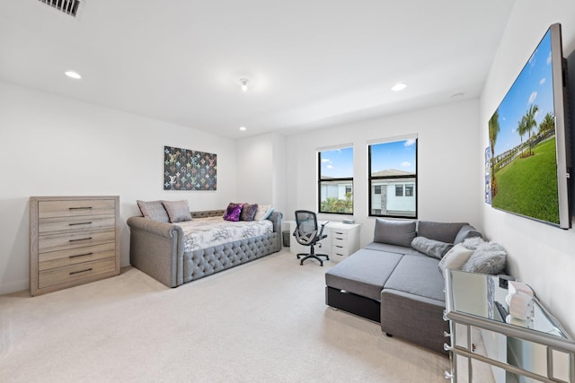 bedroom featuring light colored carpet