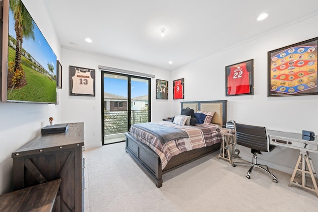 bedroom with light colored carpet and access to exterior