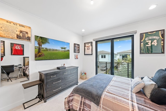 carpeted bedroom with access to exterior