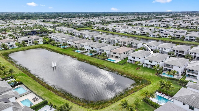 drone / aerial view with a water view