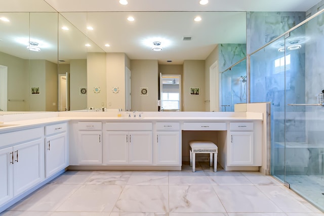 bathroom featuring vanity and an enclosed shower