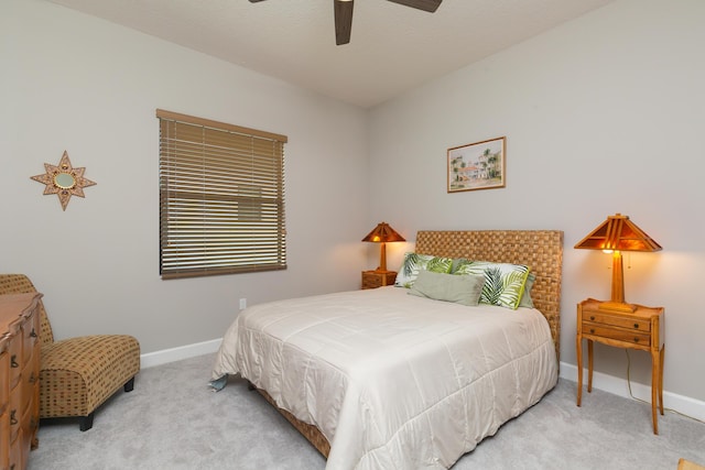 bedroom with light carpet and ceiling fan