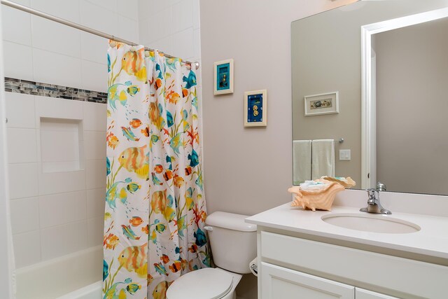 full bathroom featuring vanity, toilet, and shower / bath combo with shower curtain