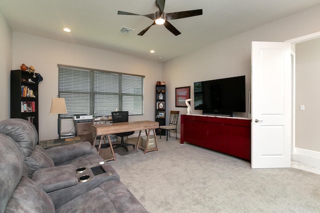 living room with ceiling fan and light carpet