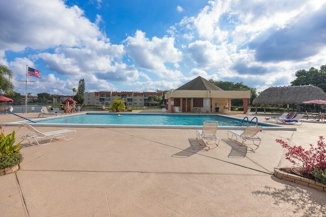 view of swimming pool with a patio