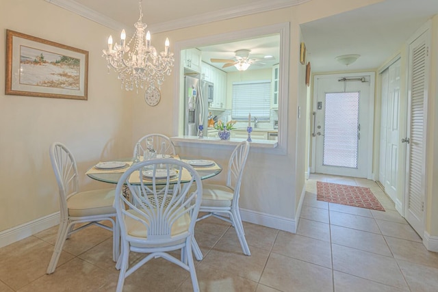 dining space with light tile patterned floors and ornamental molding