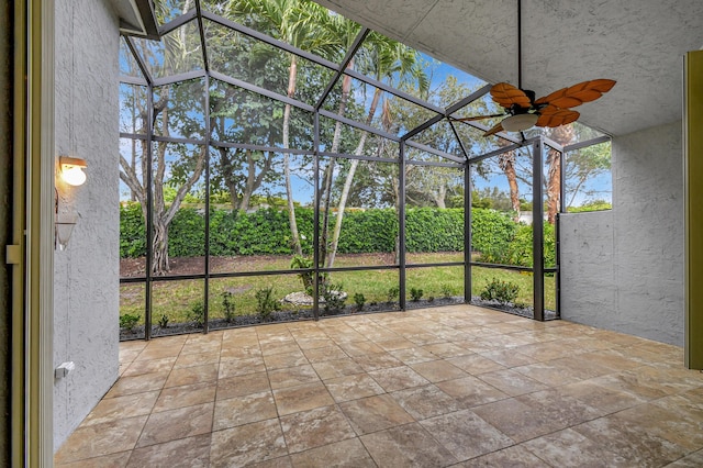 unfurnished bedroom with ceiling fan and light tile patterned floors