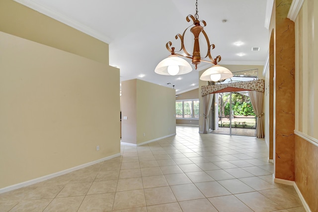 hall featuring lofted ceiling, light tile patterned floors, and ornamental molding