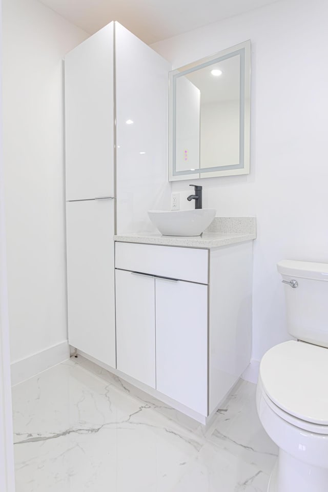 bathroom with vanity and toilet