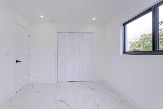 unfurnished bedroom with a closet