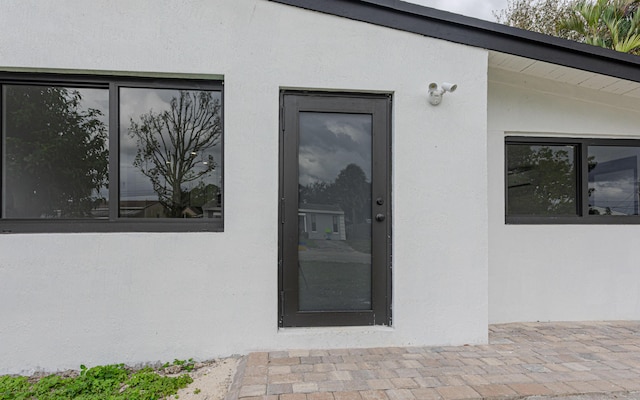 doorway to property featuring a patio area