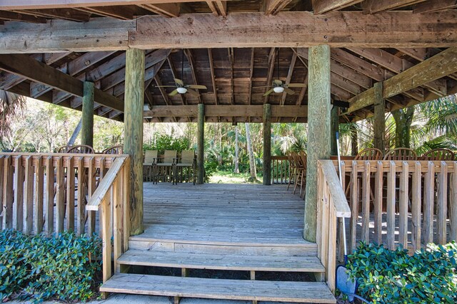 wooden terrace featuring a ceiling fan