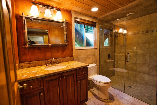 bathroom with toilet, a stall shower, tile patterned flooring, wood ceiling, and vanity