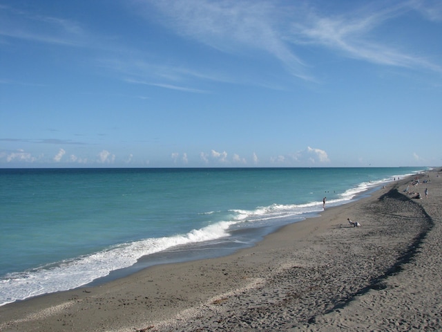 property view of water featuring a beach view