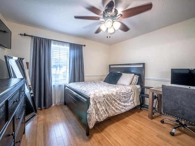 bedroom with hardwood / wood-style flooring and ceiling fan