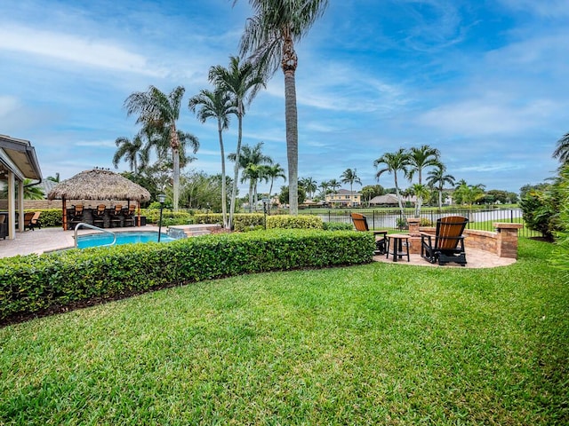 view of yard featuring a gazebo, a fenced in pool, and a patio