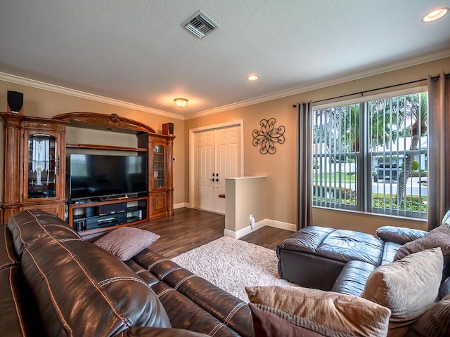 living room with ornamental molding and dark hardwood / wood-style flooring