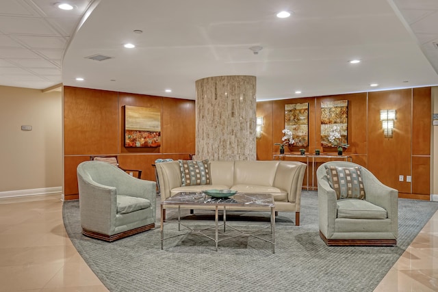 tiled living room with wood walls