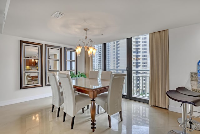 dining space with floor to ceiling windows and a notable chandelier