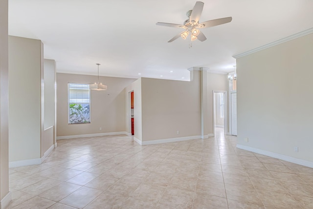 tiled spare room featuring crown molding and ceiling fan