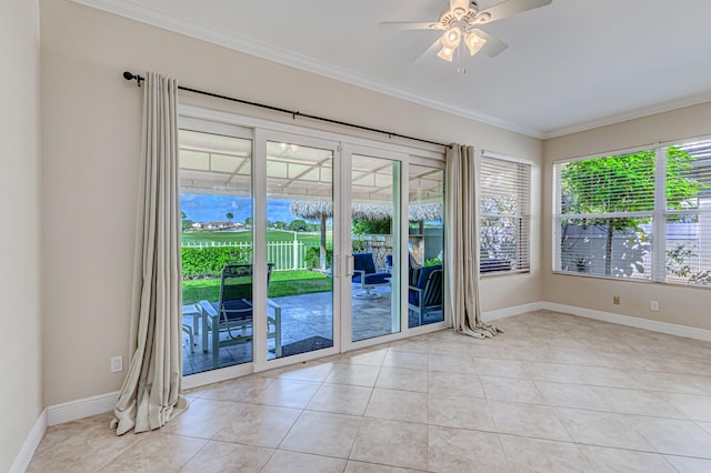 entryway featuring ornamental molding, light tile patterned flooring, ceiling fan, and french doors