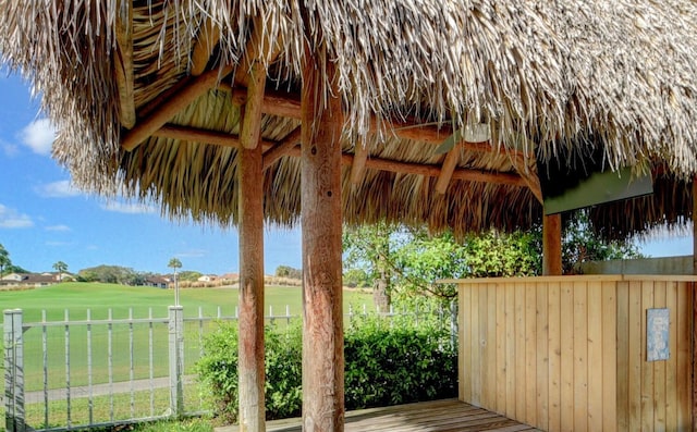 deck featuring a gazebo and a lawn