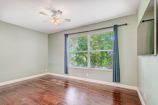 unfurnished room with wood-type flooring and ceiling fan