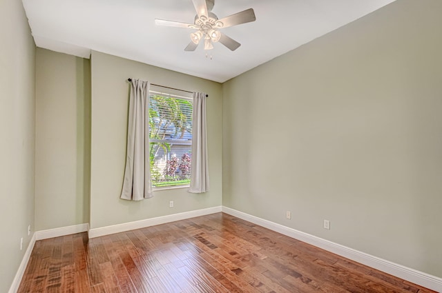 empty room featuring hardwood / wood-style flooring and ceiling fan