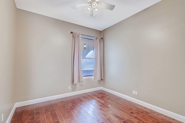 unfurnished room with hardwood / wood-style floors and ceiling fan