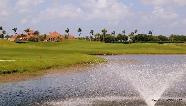 view of community featuring a water view and a yard