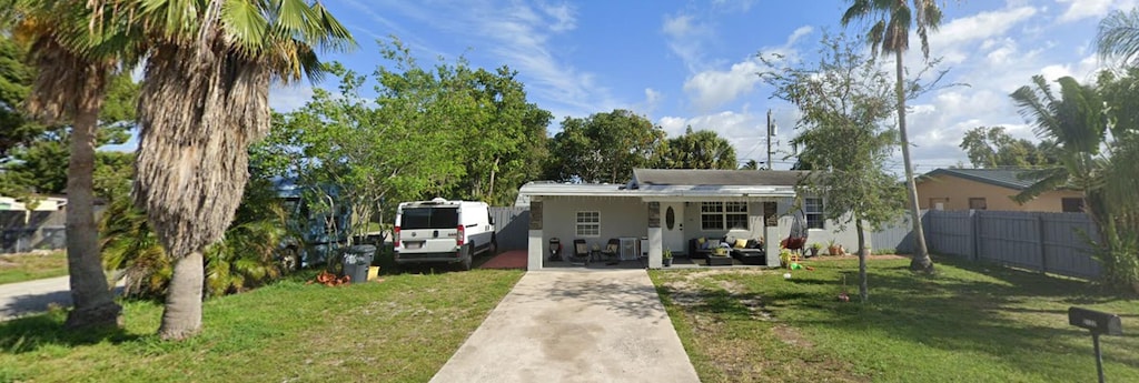 view of front of property with a front yard and covered porch