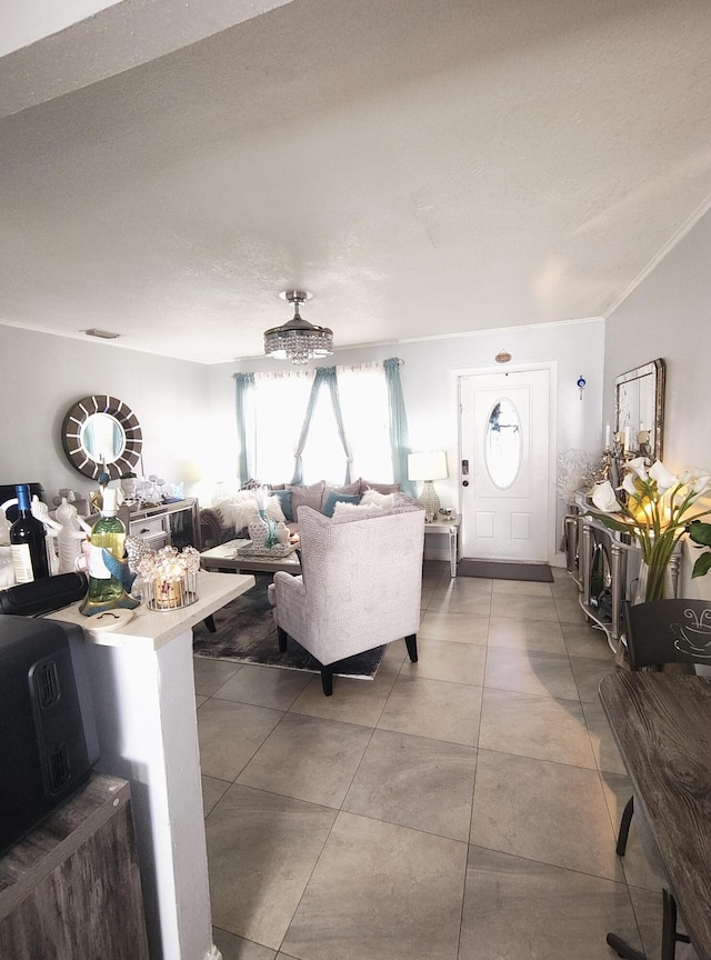 living room featuring tile patterned flooring and a textured ceiling