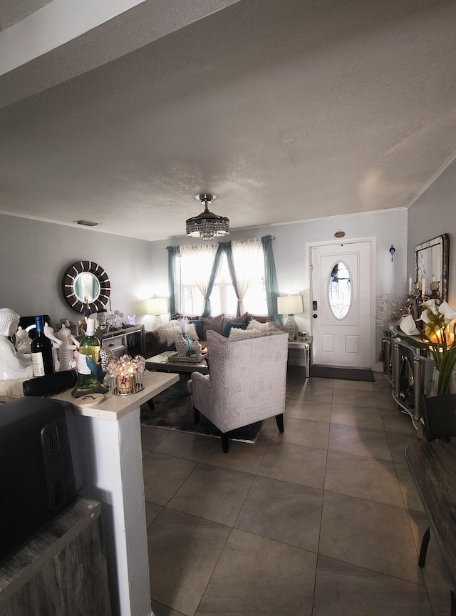 living room with dark tile patterned flooring and a textured ceiling