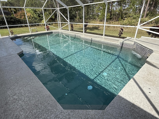 outdoor pool with a patio and a lanai