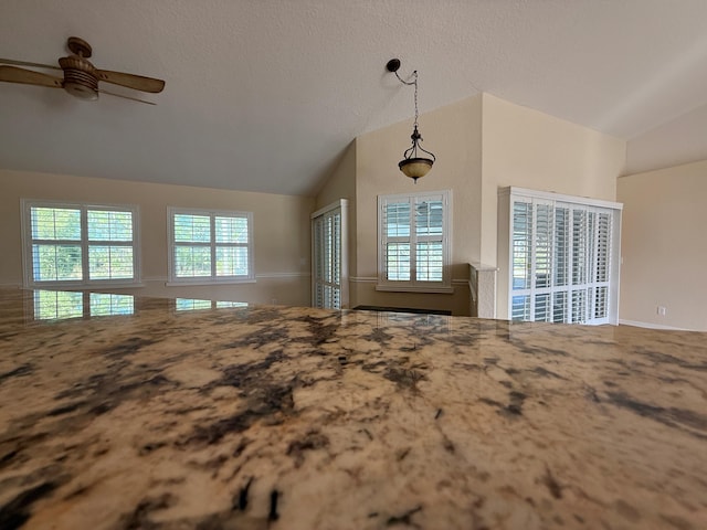 unfurnished bedroom featuring lofted ceiling