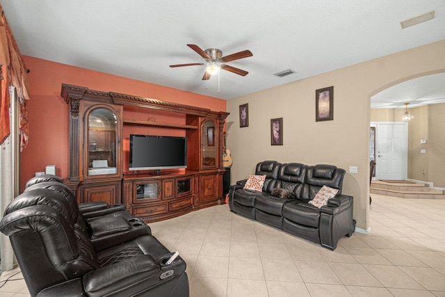 living room with ceiling fan and light tile patterned floors