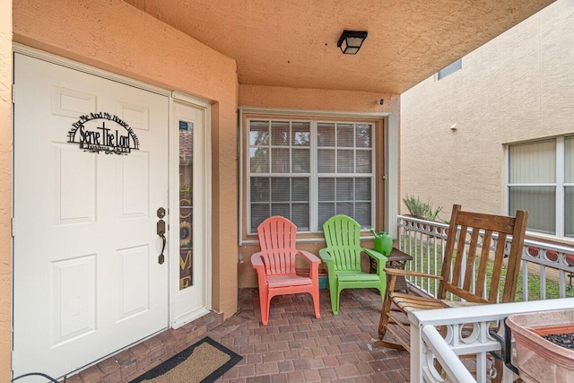 property entrance with covered porch