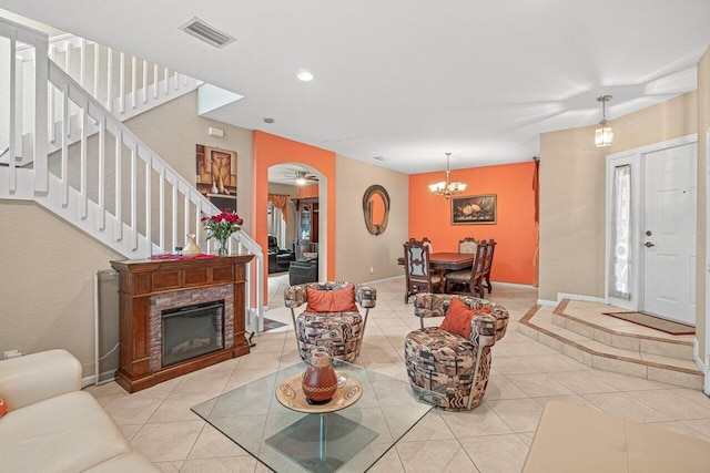 living room featuring an inviting chandelier and light tile patterned flooring