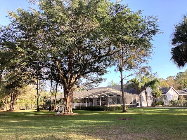 view of yard with a lanai