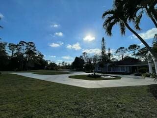 view of property's community with a lawn