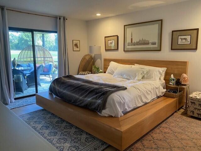 bedroom featuring access to outside and recessed lighting