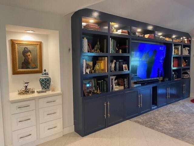 bar with white cabinetry, blue cabinets, and light tile patterned flooring