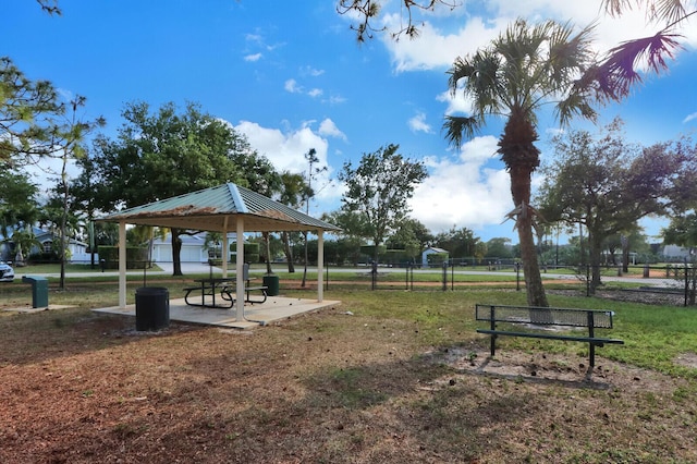 surrounding community with a gazebo and a yard