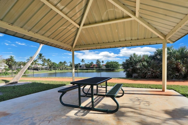 view of patio featuring a gazebo and a water view